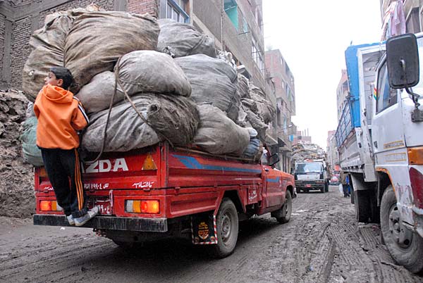 Cairo is a city of 8 million people, and yet most of the city's garbage is collected by an unofficial labor force which has been acting of its own volition for nearly 100 years. The "Zabbaleen," or "Trash People," live at the foot of the Muqqattam Hills on the city's east side. They collect, sort, sell, recycle, and reuse the vast majority of Cairo's refuse.